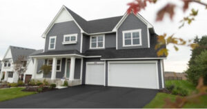 large home with gray engineered wood siding