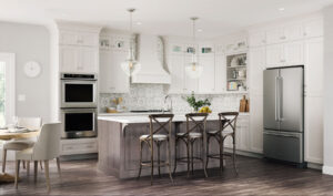 attractive kitchen space with island and white cabinetry